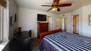 Bedroom with carpet and ceiling fan