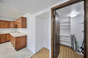 View from laundry into kitchen and pantry and refrigerator alcove.