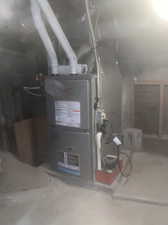 Upgraded high efficiency furnace in basement crawl space.