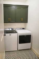 The laundry room features full upper cabinets, tiled backsplash, and the washer/dryer are included.