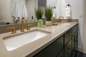 Elegant touches include 9" offset faucets, square 'barrel' sinks, and upgraded hardware.