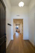 Spacious entry with 13' ceilings.