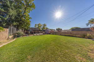 View of yard featuring a storage shed