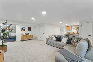 Living room featuring light carpet