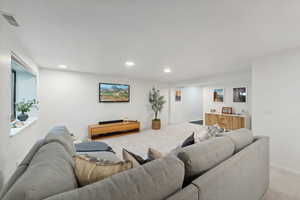 Living room featuring light colored carpet