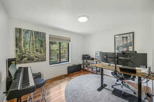 Home office featuring hardwood / wood-style floors