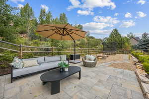 View of patio / terrace featuring an outdoor living space with a fire pit