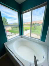 Bathroom with tiled bath