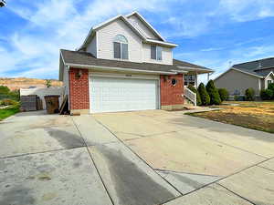 View of front of property featuring a garage