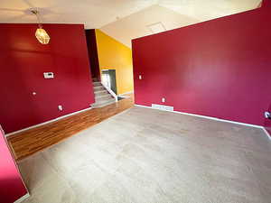 Interior space with wood-type flooring and vaulted ceiling