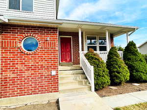 Property entrance with a porch