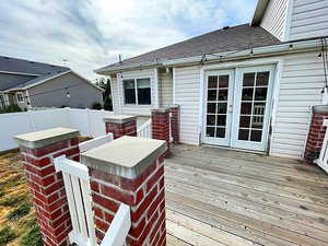 Wooden deck featuring french doors