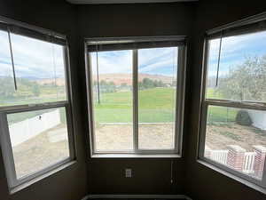 Sunroom / solarium with a mountain view and a healthy amount of sunlight