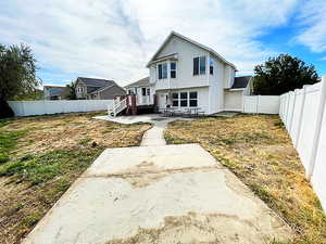 Rear view of property featuring a patio