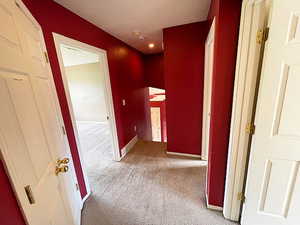 Corridor with carpet flooring