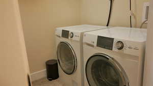 Laundry room featuring washing machine and dryer