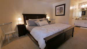 Primary Bedroom with  carpet and ensuite bath