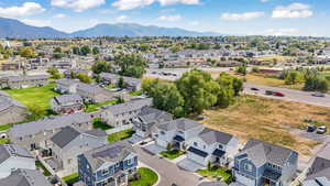 Aerial view of residential area featuring a mountainous background