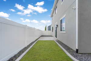 Fenced backyard featuring a patio area