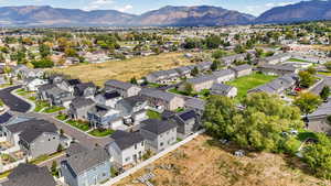 Aerial perspective of suburban area with a mountain backdrop