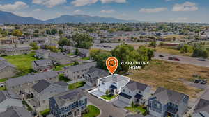Aerial perspective of suburban area featuring a mountain backdrop