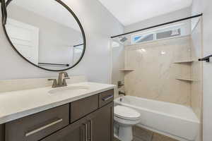 Bathroom featuring shower / bath combination, vanity, and light wood-type flooring