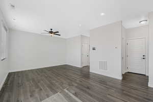 Family room featuring dark wood-type flooring, ceiling fan, and recessed lighting