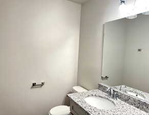 Bathroom featuring vanity and toilet