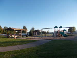 View of playground featuring a yard