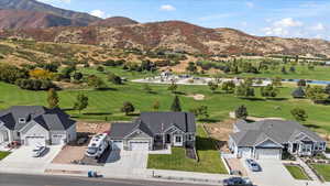 Birds eye view of property with a mountain view