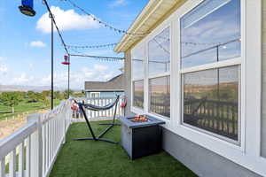 Balcony featuring a fire pit