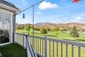 Unfurnished sunroom featuring a mountain view