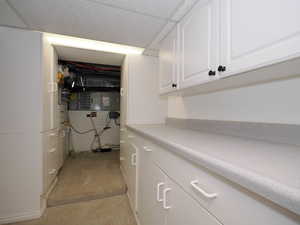 Clothes washing area with light colored carpet