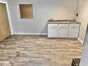 Interior space featuring hardwood / wood-style flooring and vanity