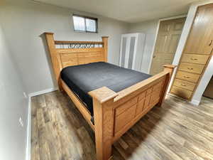 Bedroom with hardwood / wood-style floors