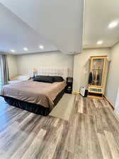 Bedroom with wood-type flooring