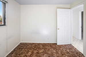 View of carpeted spare room