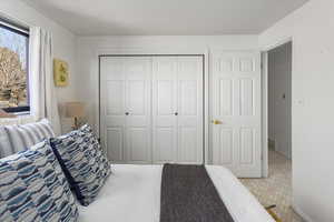 Bedroom with carpet floors and a closet