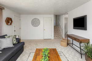 Living room featuring a textured ceiling