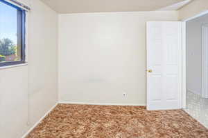 Empty room with carpet flooring