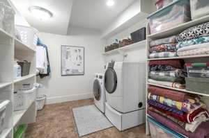 Laundry room featuring independent washer and dryer