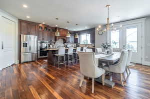 Dining room featuring a notable chandelier and  hardwood floors