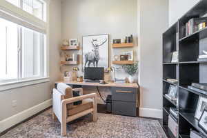 Office space featuring built in desk