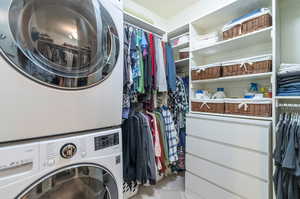 Master Closet featuring stacked washer / drying machine