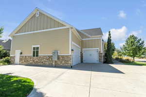 View of side of home with a garage