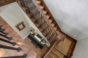 Stairway featuring carpet and a towering ceiling