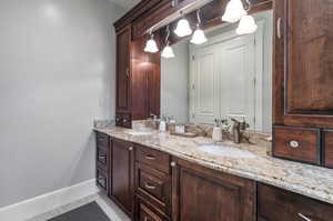 Bathroom with vanity and tile patterned flooring