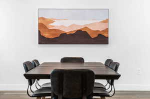 Dining area with wood-type flooring