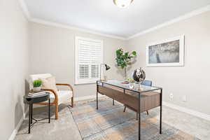 Office area featuring light carpet and ornamental molding