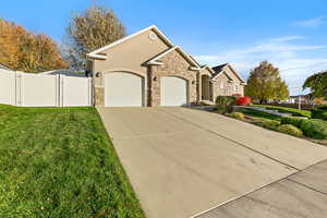 View of front facade with a garage and a front yard